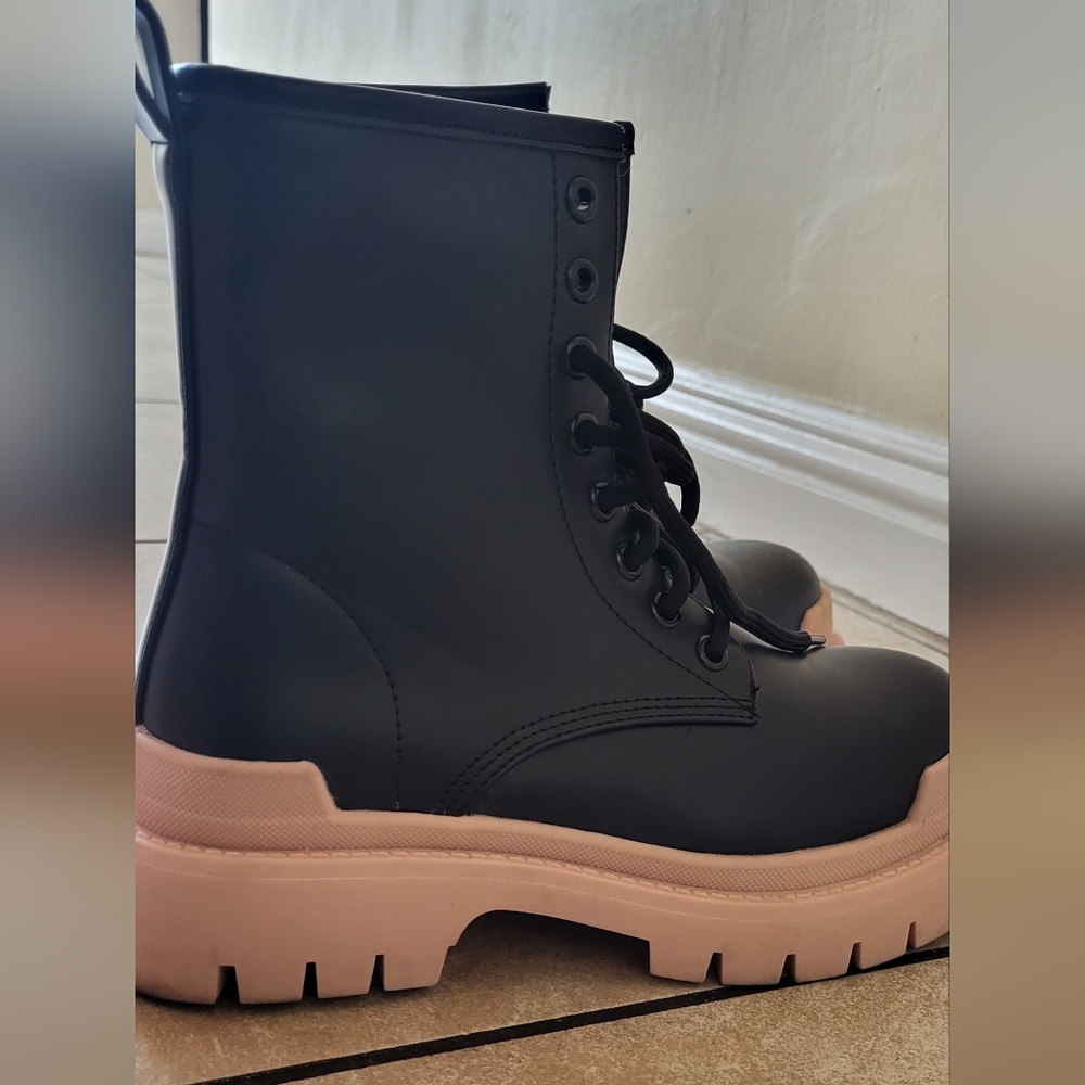 Black boots with flesh color soles